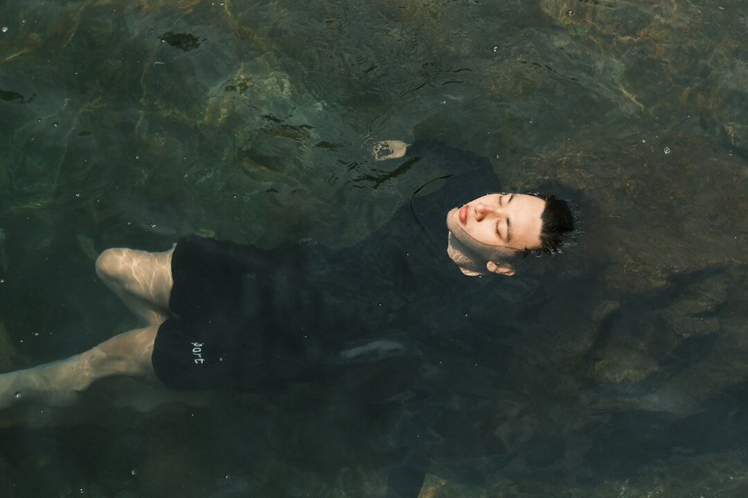 famous person swimming in clear water